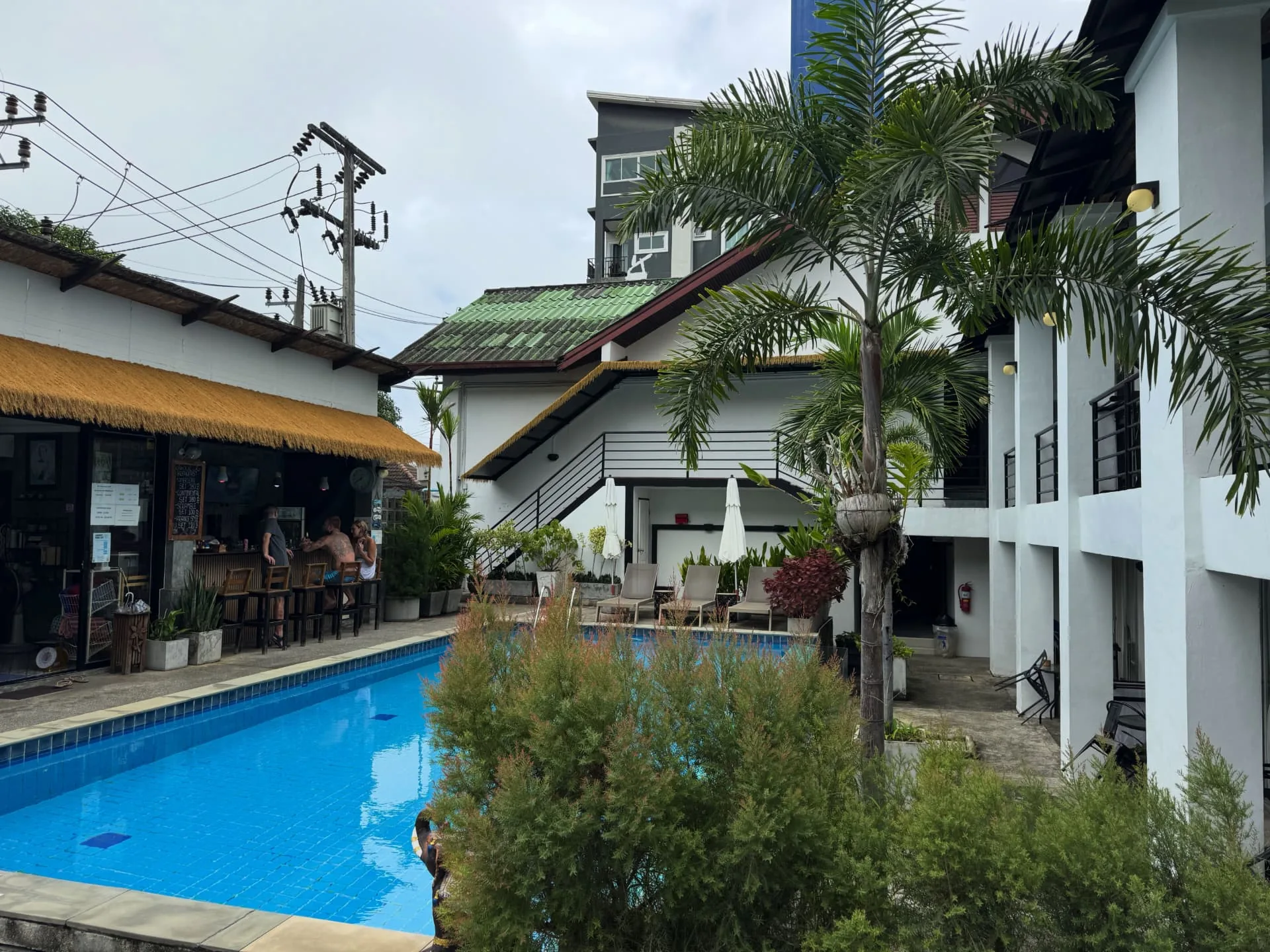 Courtyard swimming pool with the poolside bar and loungers